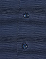 Men's long-sleeve button-up shirt in navy with a pin dot pattern and two dark buttons. Features subtle texture.