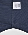 Men's long sleeve button-up shirt in navy with a pin dot pattern, featuring a label.