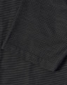 A close-up of a men's black pin dot stretch short-sleeve shirt featuring a pocket and a textured fabric.