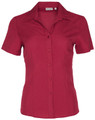 A red short sleeve shirt with a collar, featuring a button-down front and a logo on the label.