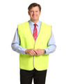 A Hi-Vis safety vest in bright yellow, featuring reflective trim, worn by a man in a collared shirt and tie.