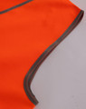 A close-up of a bright orange safety vest with grey trim, designed for children's safety wear.