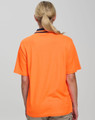 An orange hi-vis safety polo shirt with a plain back and a collar. Includes branding details.