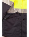 A high-visibility two-tone rainproof safety jacket featuring bright yellow and navy with reflective strips and a pocket.