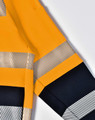 A bright yellow work jumper featuring reflective stripes and a dark navy blue lower section. Includes a logo.