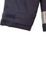 A dark navy safety jacket with reflective 3M tape and a velcro patch on the sleeve. Features branding.