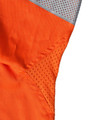 An orange work shirt featuring grey mesh panels, designed for safety in a work environment.