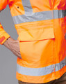 An orange safety jacket with reflective stripes and a pocket, designed for high visibility. Contains a logo.