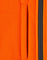 A close-up of an orange fabric featuring a zippered pocket, part of a safety jacket design.