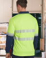A bright yellow and navy long-sleeve polo shirt with reflective stripes, featuring a logo on the front.
