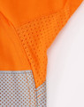 An orange long-sleeve shirt featuring perforated silver tape detailing. The shirt has a logo.