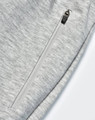 A pair of light grey poly/cotton terry sweat pants featuring a zip pocket.