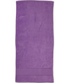 A purple terry velour beach towel measuring 75x150 cm, featuring a plain design with a logo.