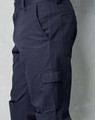 Men's cargo pants in navy blue, featuring knee pads and multiple pockets, with a sleek, fitted design.