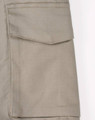 Unisex cotton stretch ripstop work shorts in a light beige colour featuring side pockets and a logo.