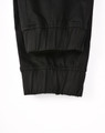 Cuffed work pants in black cotton stretch drill fabric, featuring a comfortable, fitted design.