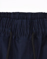 Dark navy unisex cotton stretch drill cuffed work pants with an elastic waistband and drawstring detail.