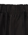 A close-up of the waistband of black unisex cotton stretch drill work shorts, featuring an elastic band and drawstring.