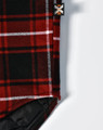 A red and black quilted flannel shirt with a plaid pattern and a small logo.