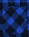 A close-up of a unisex button-up flannel shirt featuring a blue and black plaid pattern with a chest pocket.