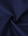 A close-up of navy fabric with a smooth texture, suitable for clothing. The fabric appears durable and lightweight.