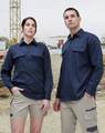 A closed front long sleeve work shirt in navy, displayed on a male and female model in a construction setting.