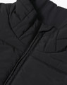 A black insulated puffer vest featuring a 3D cut and a zipper, with a branded logo.