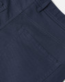 A close-up of navy flexi chino pants, highlighting the stitching and pocket details. The fabric appears sturdy and stylish.