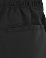 Black unisex mercerised cotton shorts featuring an elastic waistband and a side pocket. Includes branding on the fabric.