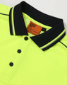 A bright yellow safety polo shirt with a navy collar and logo details.