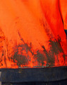 A Hi-Vis two-tone water-resistant fleece hoodie in orange, featuring a soiled fabric texture and a navy blue hem.