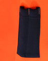A close-up of a bright orange fleece hoodie featuring a navy blue pocket and contrasting stitching. It has a logo.
