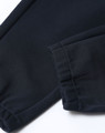 Unisex airlayered CVC sweatpants in navy, featuring a cuffed hem and soft fabric texture. Complete with a logo.