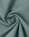 A close-up of soft, premium cotton fabric in a sage green colour, showcasing its texture and quality.
