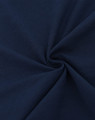 A close-up of navy blue cotton fabric, showcasing a smooth and soft texture with a spiral pattern.