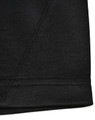 A close-up of a black sustainable poly/cotton polo shirt showing the hem and stitching details. Features a logo.
