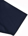 A close-up of the sleeve of a navy blue men's polo shirt with a smooth fabric texture.