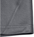 A close-up of the hem and fabric of a grey men's sustainable polo shirt, featuring a stitched edge.