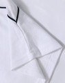 A white kids’ polo shirt with short sleeves and black detailing, featuring a logo.