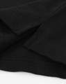 A close-up of a black cotton stretch polo shirt, highlighting the fabric texture and stitching details.