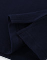 A navy ladies cotton stretch polo shirt, featuring folded sleeves and a smooth fabric texture. It has a logo.