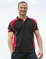 A men's polo shirt in black with red accents and a logo. The model is smiling and standing outdoors.