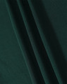 A close-up image of dark green fabric with soft texture, showcasing folds and draping.