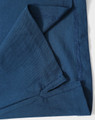 A folded section of a navy blue polo shirt featuring stitching details and a logo.