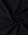 A close-up of black fabric in a swirling pattern, showcasing the texture and weave of the material.