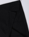 A black polo shirt featuring a classic collar and a logo, highlighting the fabric texture and stitching details.