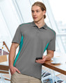 A dark green polo shirt with bright green accents and a logo, worn by a man standing indoors.