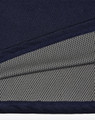 A close-up of a navy polo shirt detailing with a grey mesh inner lining, featuring a logo.