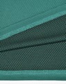 A fabric close-up of a teal bamboo charcoal polo shirt, featuring textured and dotted patterns.
