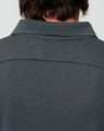 A dark grey men's bamboo charcoal long-sleeve polo shirt, focusing on the back collar and textured fabric.